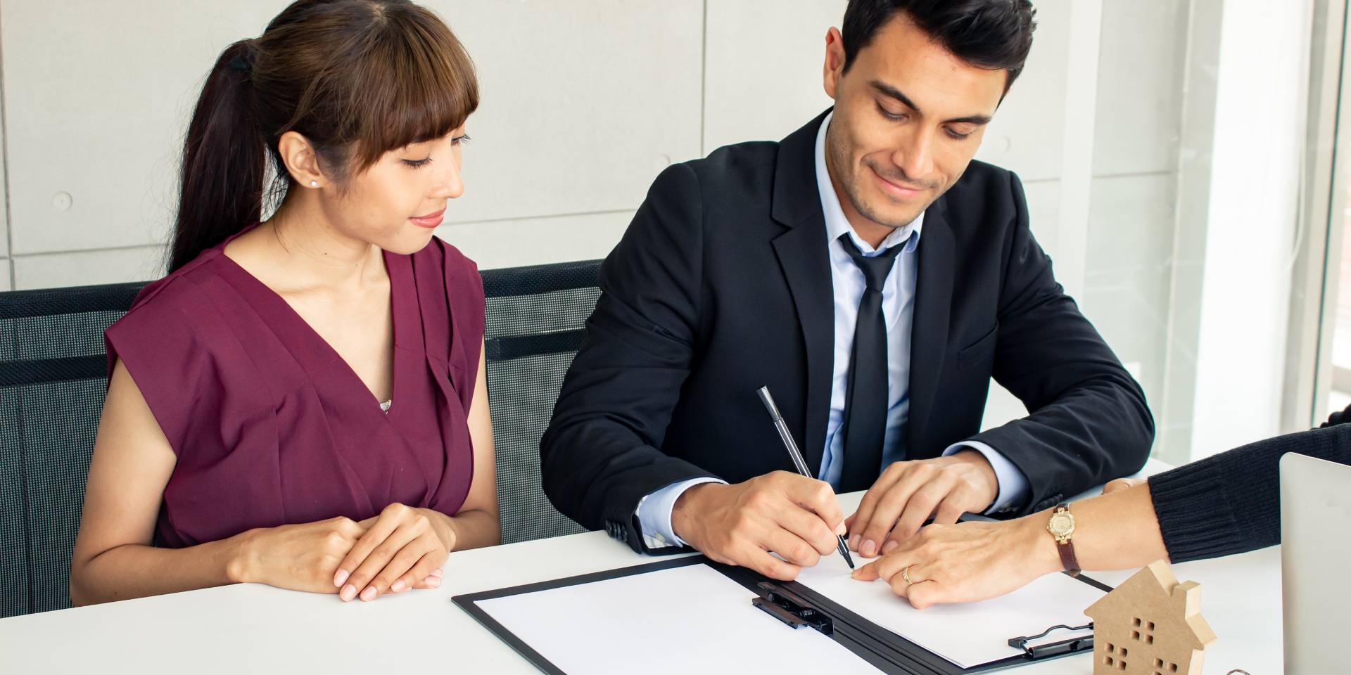 Real estate attorney reviewing a property deed with a Nevada homeowner