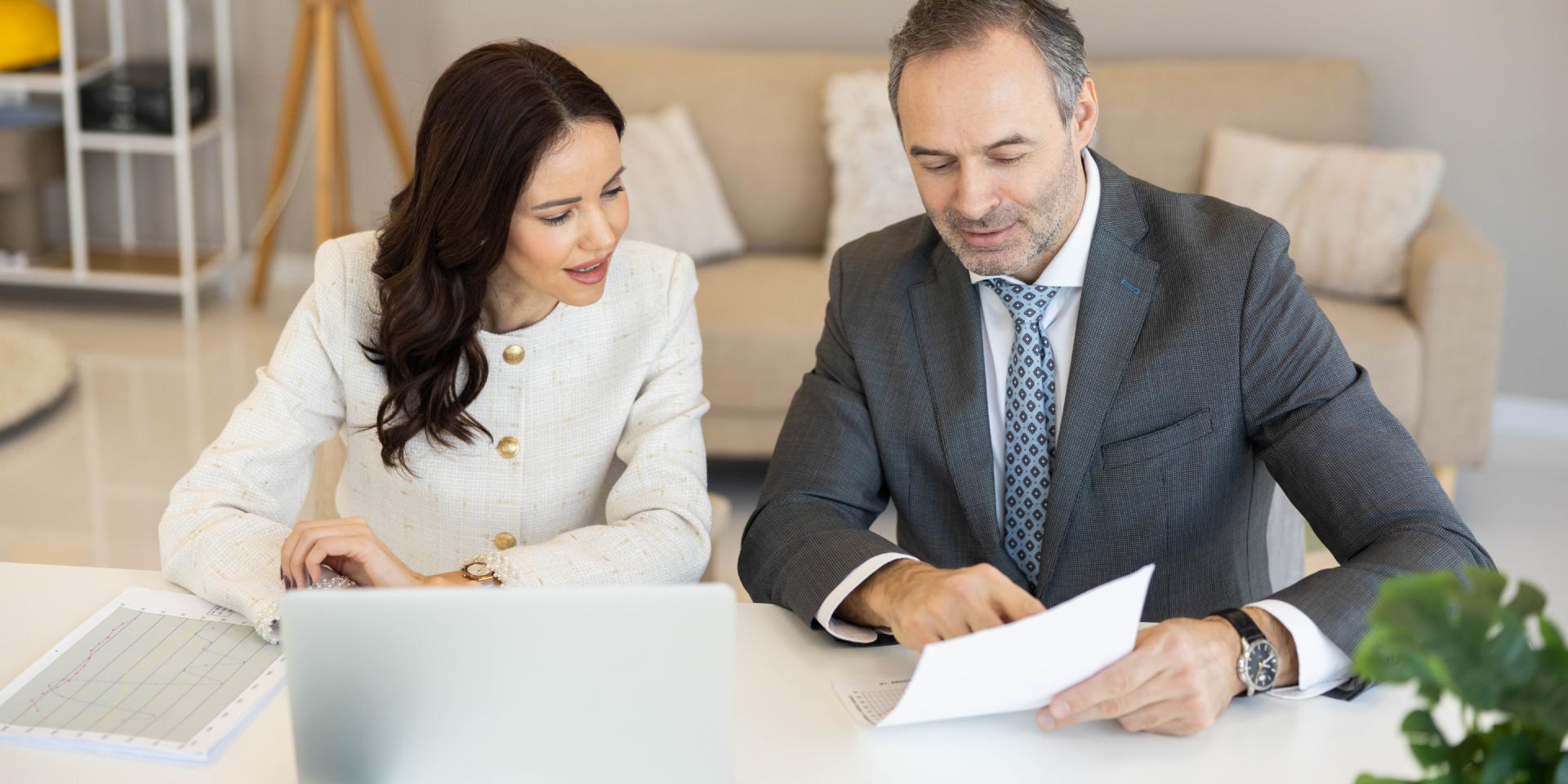 Real estate attorney reviewing property purchase documents with a buyer in Nevada