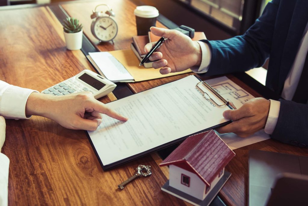 Property title, purchase agreement, and legal documents reviewed during real estate due diligence