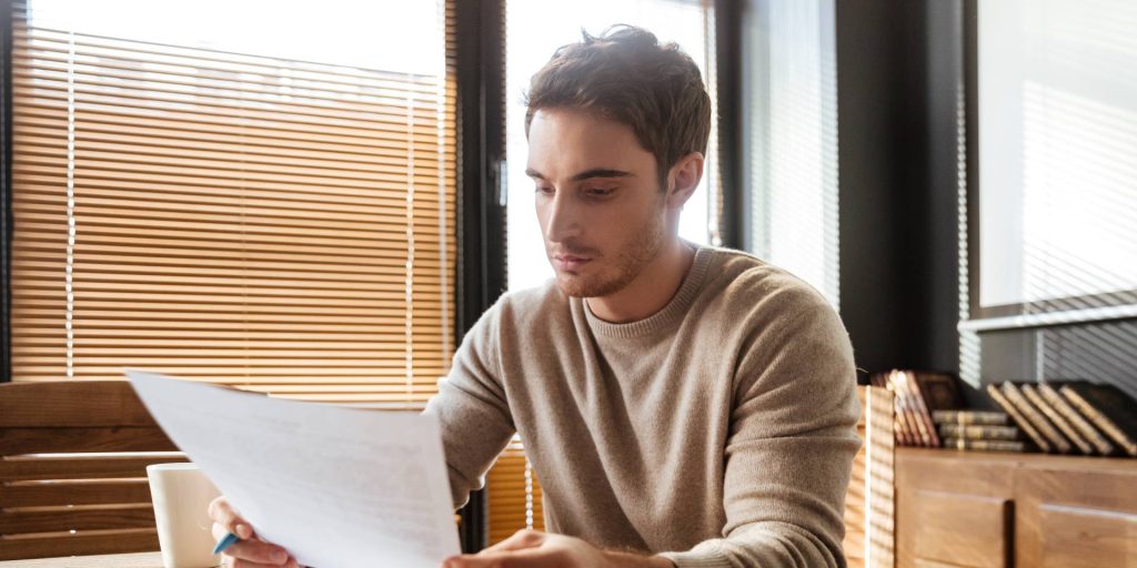 Homebuyers reviewing a purchase contract before signing