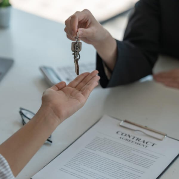 Homeowner reviewing FSBO real estate documents with Reno Nevada property attorney for home sale without realtor