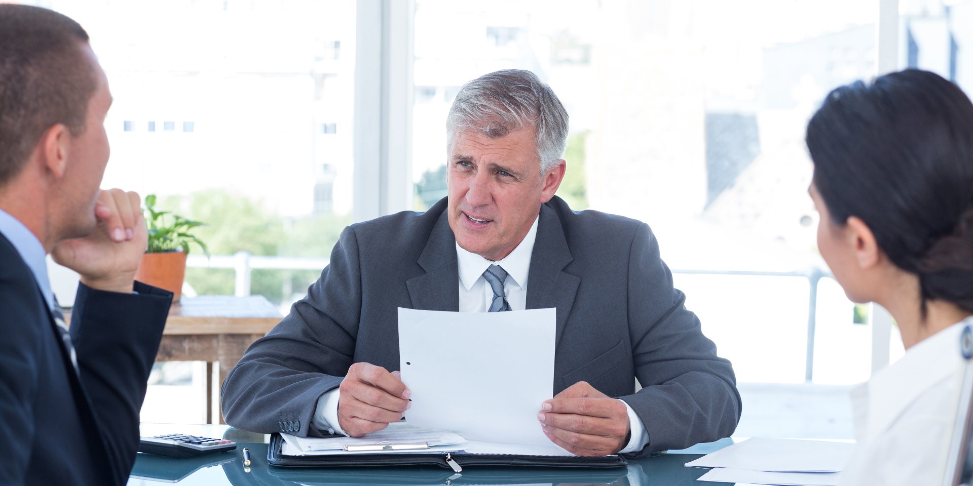 Nevada real estate attorney explaining an owner financing agreement to a buyer and seller