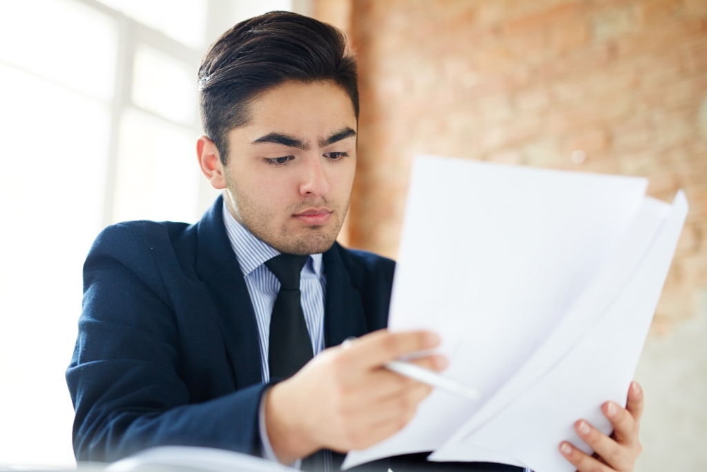 attorney reviewing property title documents following a Nevada divorce