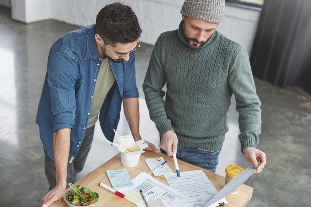 Co-owners reviewing mortgage, property expenses, and financial records in a Nevada property dispute