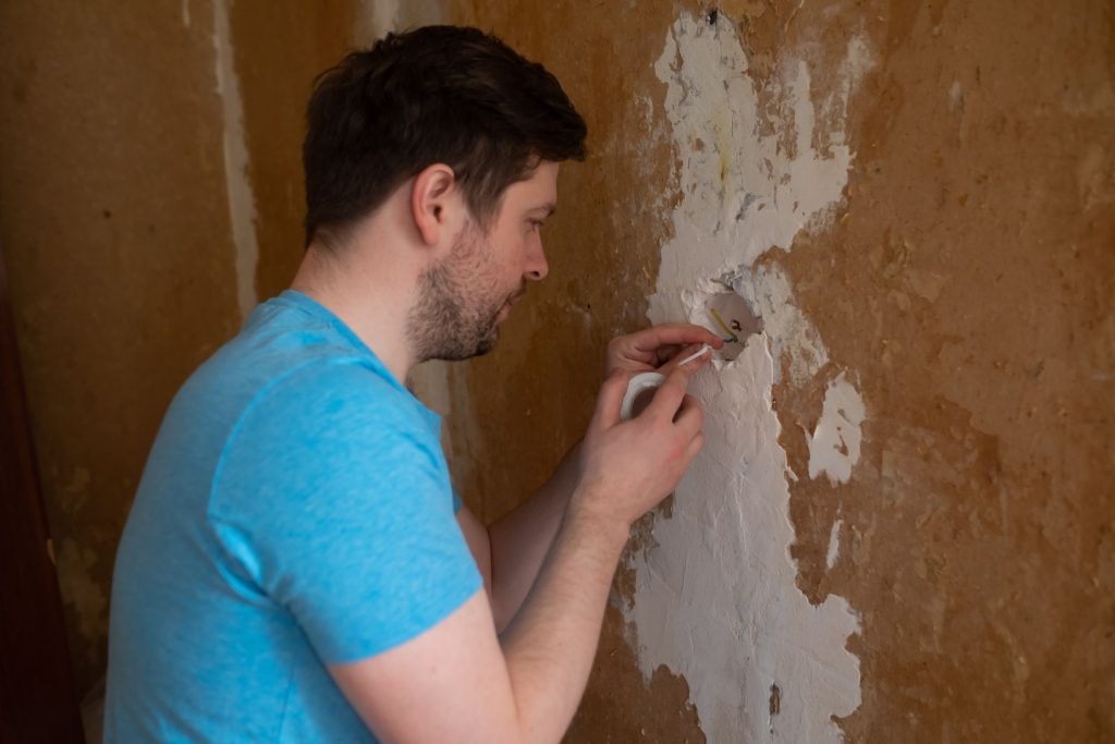 Homeowner inspecting a construction defect discovered after a builder warranty expired in Las Vegas