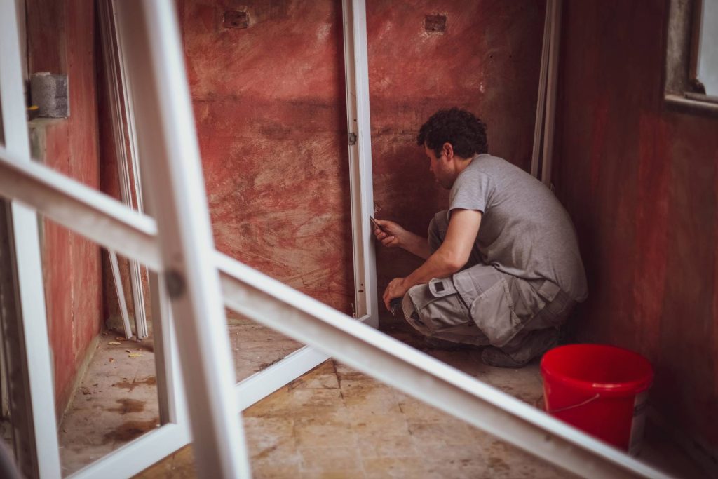 Construction expert inspecting water intrusion and building envelope damage in a Nevada home