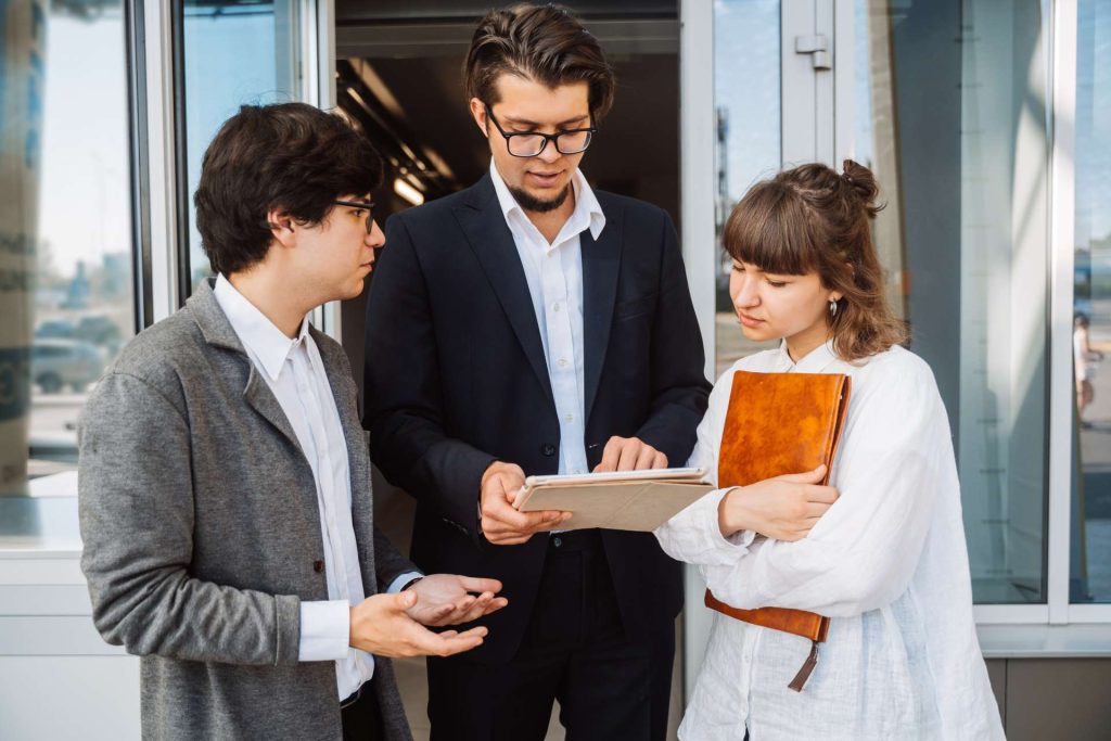 Nevada real estate attorney reviewing a property deed and ownership transfer documents with a co-owner considering removing their name from the deed