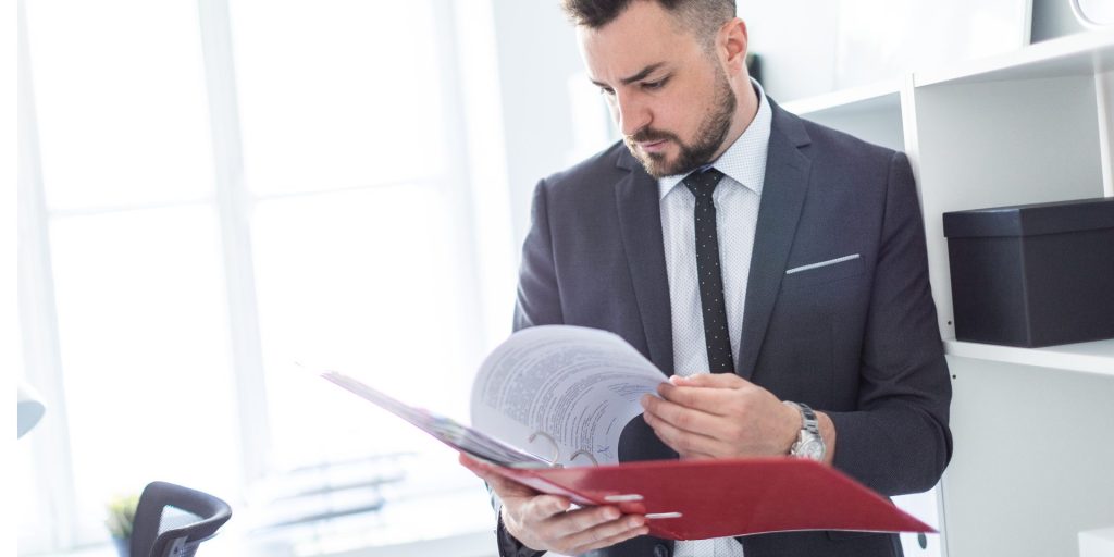 Las Vegas real estate attorney reviewing property survey documents for an encroachment dispute