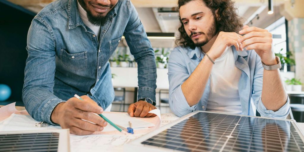Buyer and seller reviewing solar lease transfer documents for a Nevada property