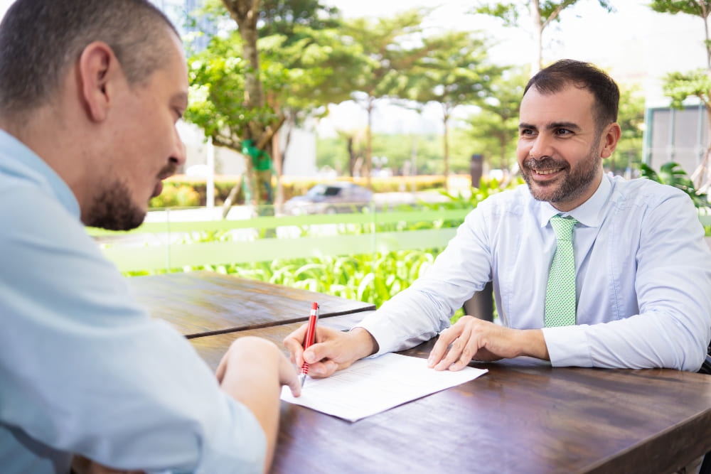 Buyer and seller signing documents at a Nevada escrow closing
real estate lawyer