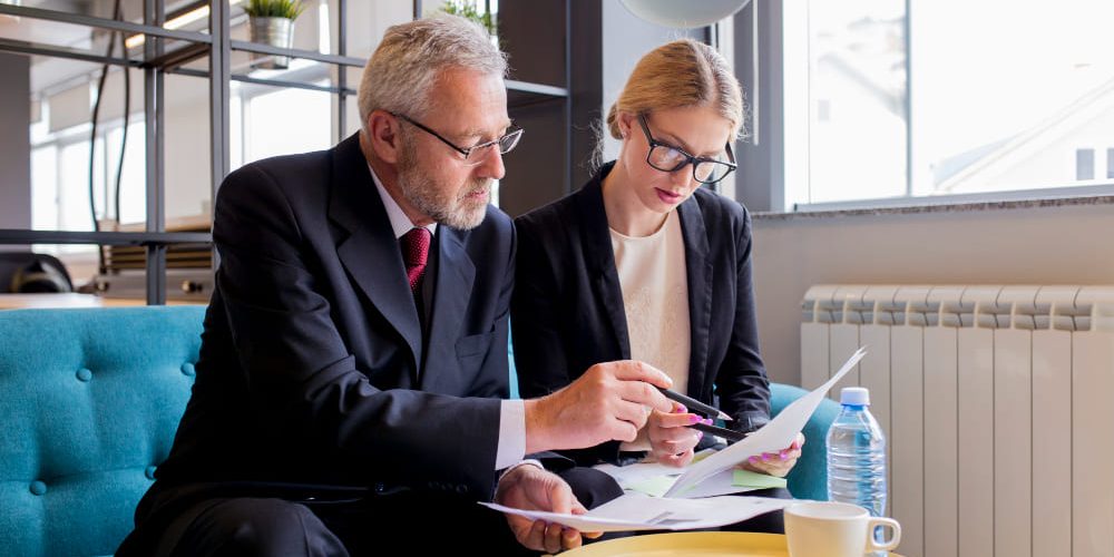 commercial-lease-guaranty-attorney-nevada Attorney reviewing a commercial lease and personal guaranty with a Nevada business owner