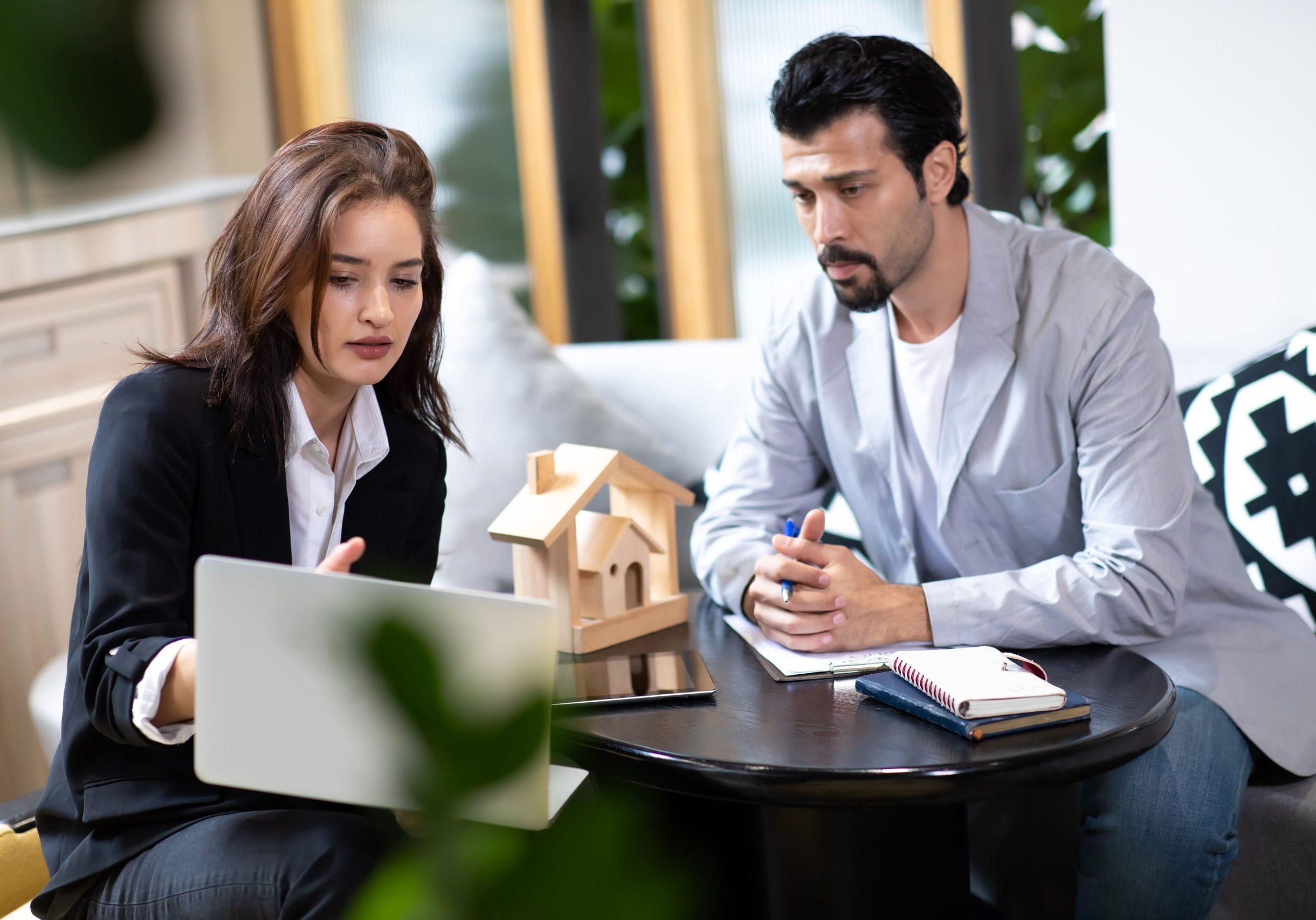 Buyer and seller reviewing commercial property negotiation terms in Nevada