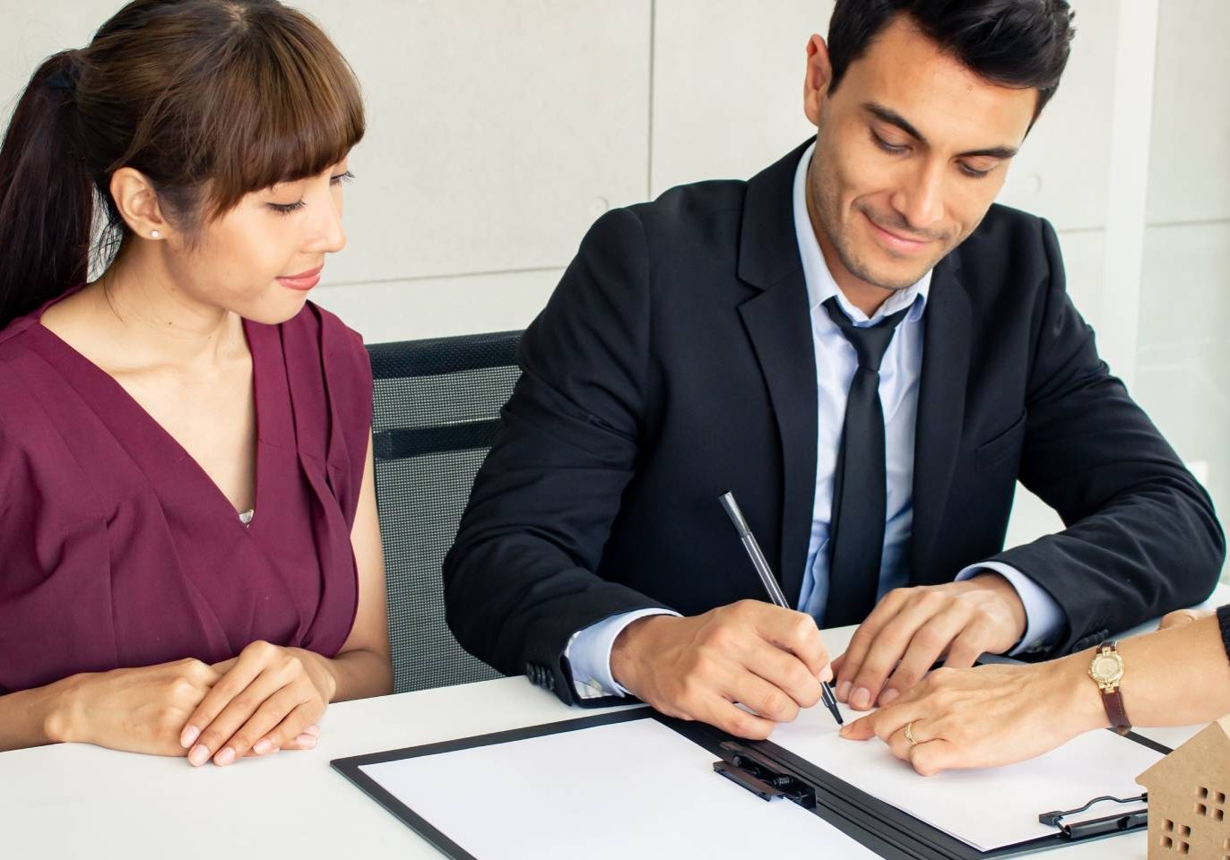 Real estate attorney reviewing a property deed with a Nevada homeowner