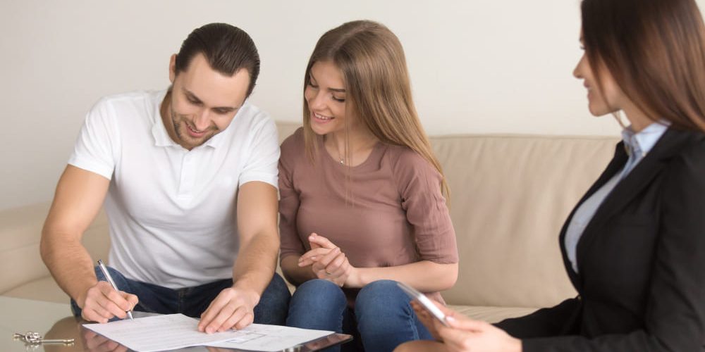 Nevada real estate lawyer reviewing a property purchase contract with a client, Real Estate Lawyer