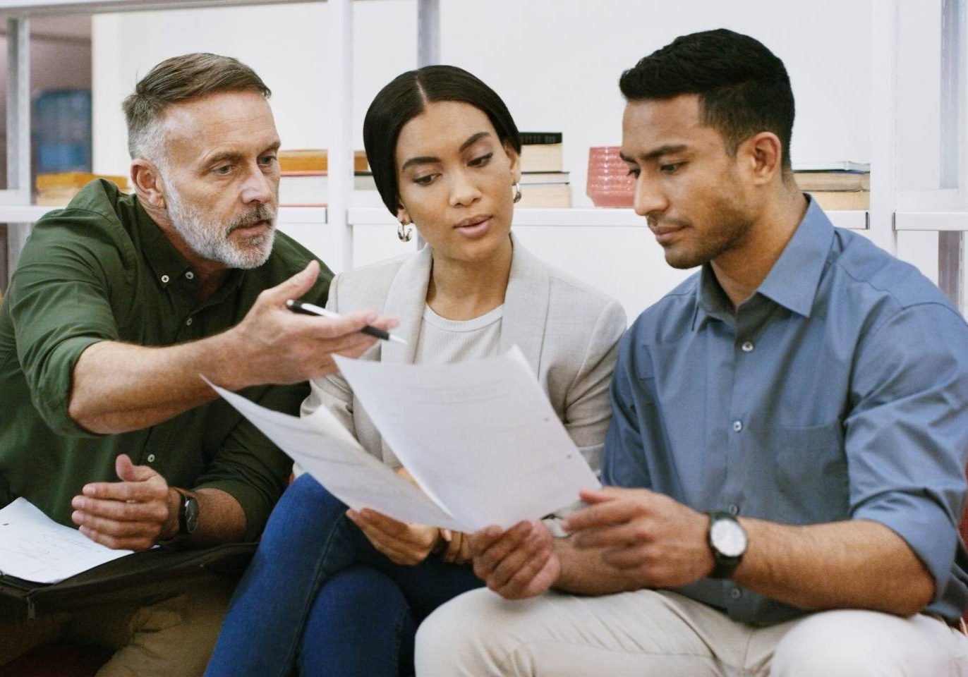 Family members reviewing documents for inherited property ownership in Nevada