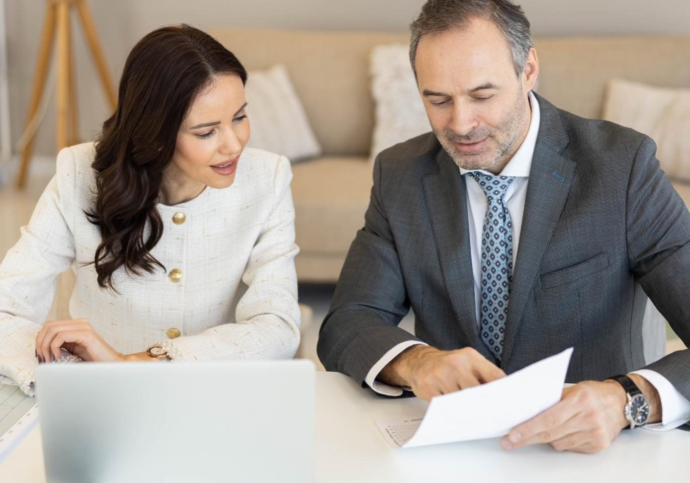 Real estate attorney reviewing property purchase documents with a buyer in Nevada