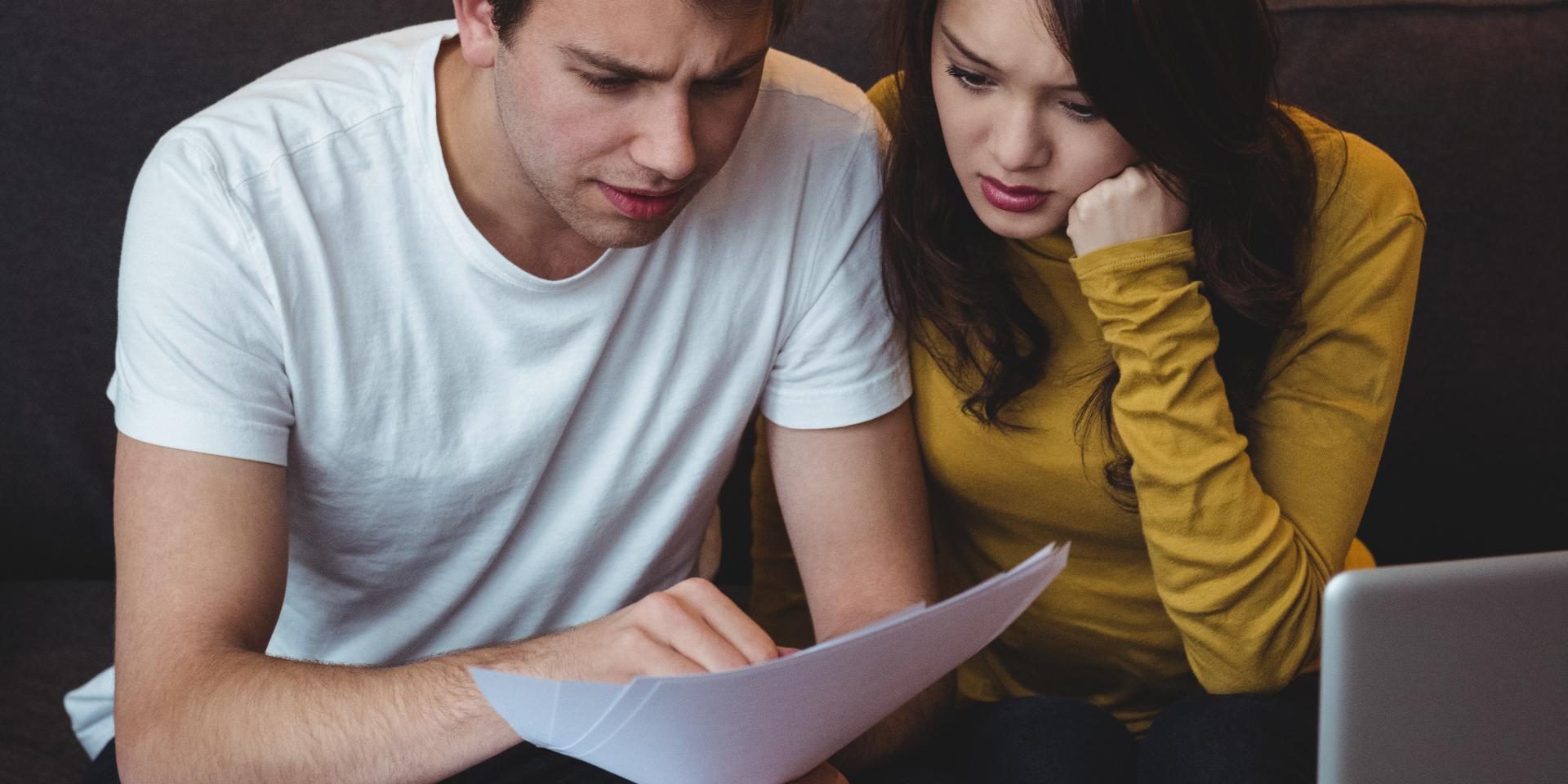 nevada-foreclosure-timeline Nevada homeowner reviewing a foreclosure timeline and mortgage documents