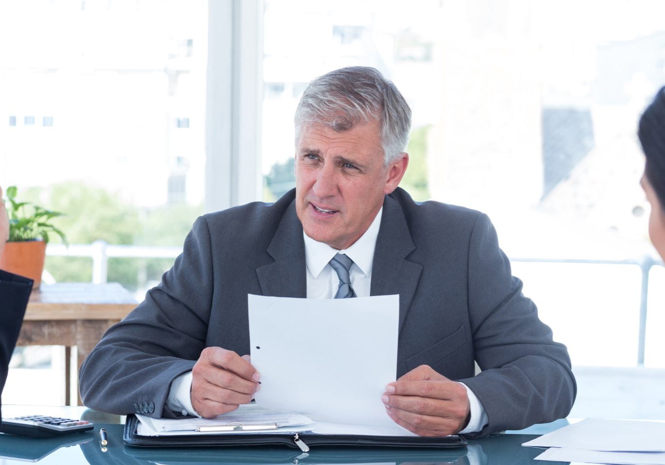 Nevada real estate attorney explaining an owner financing agreement to a buyer and seller