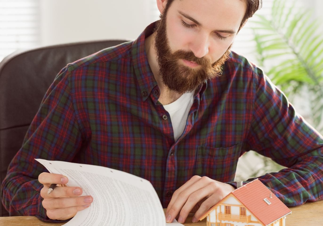 Nevada co-owner reviewing property deed documents while considering how to transfer ownership
