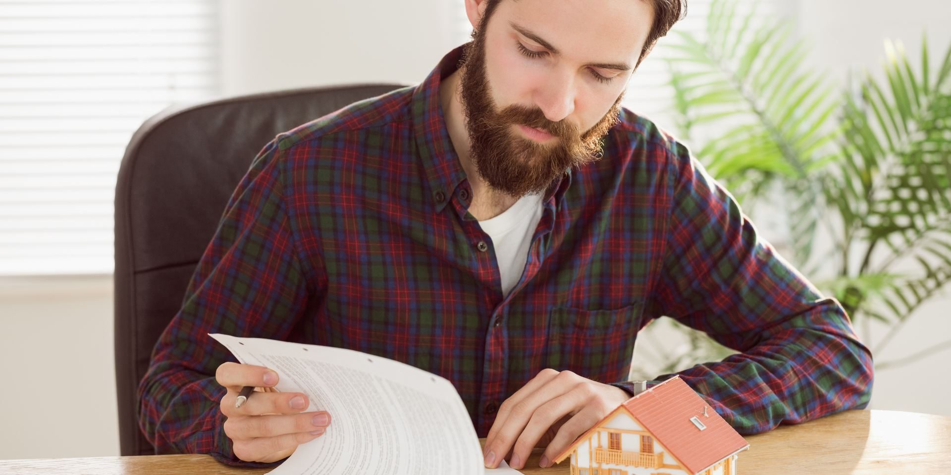 remove-name-from-deed-nevada Nevada co-owner reviewing property deed documents while considering how to transfer ownership