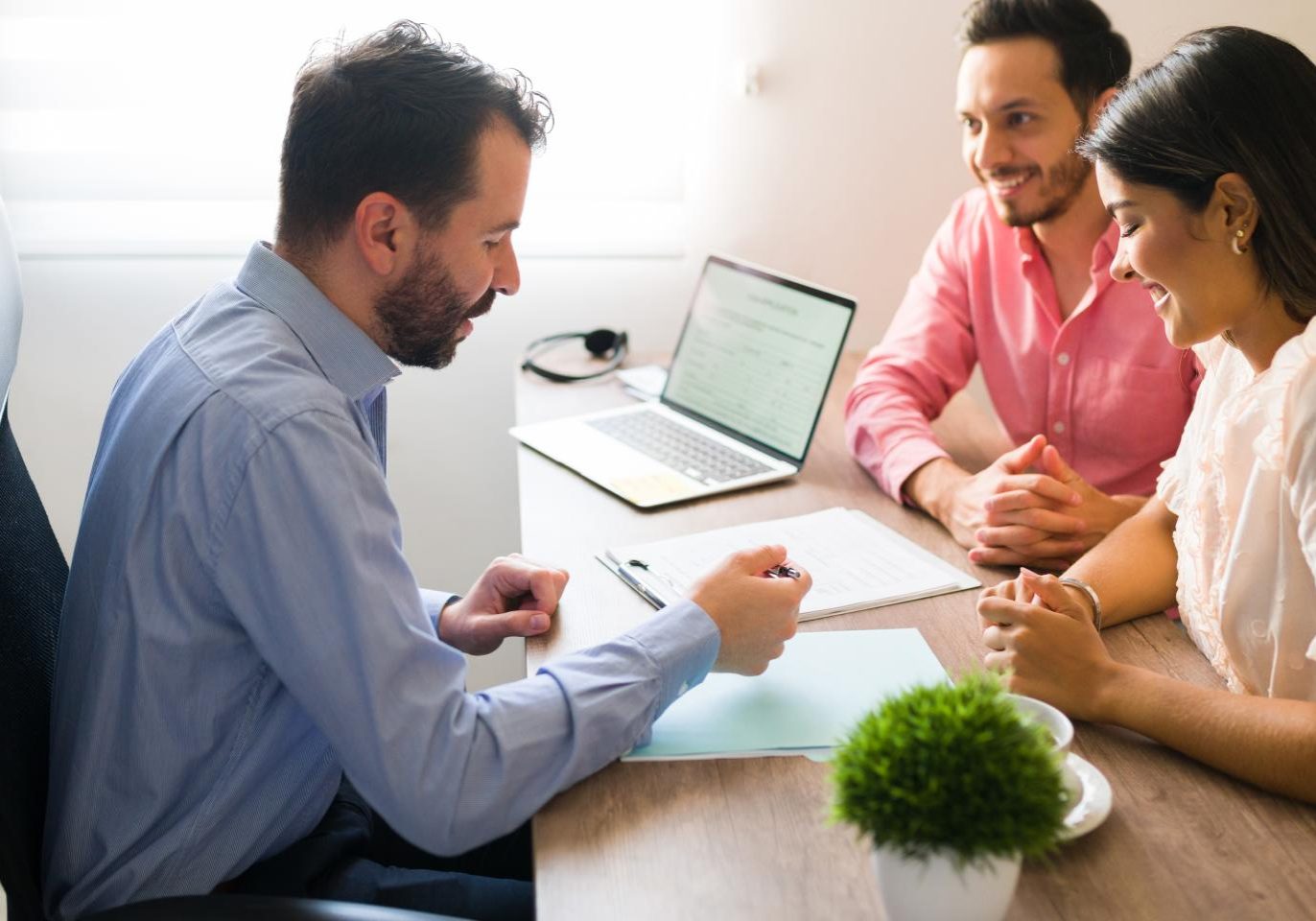 Real estate attorney reviewing title documents with a property buyer before closing