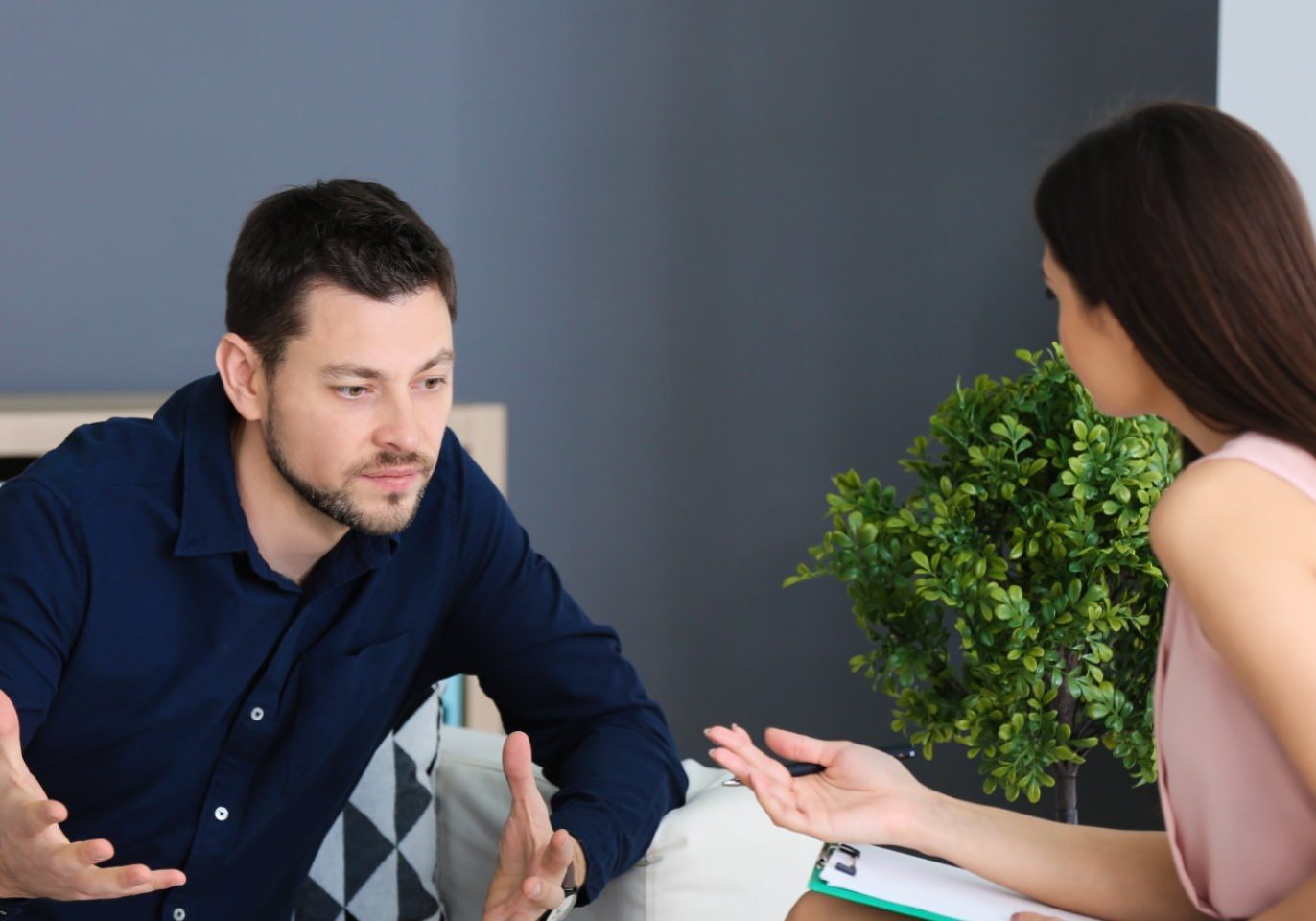 Former partners discussing what to do with a jointly owned house after separation in Nevada