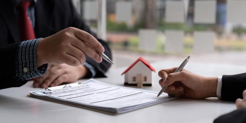 Nevada property owner reviewing documents with a real estate lawyer before signing a purchase agreement real estate lawyer