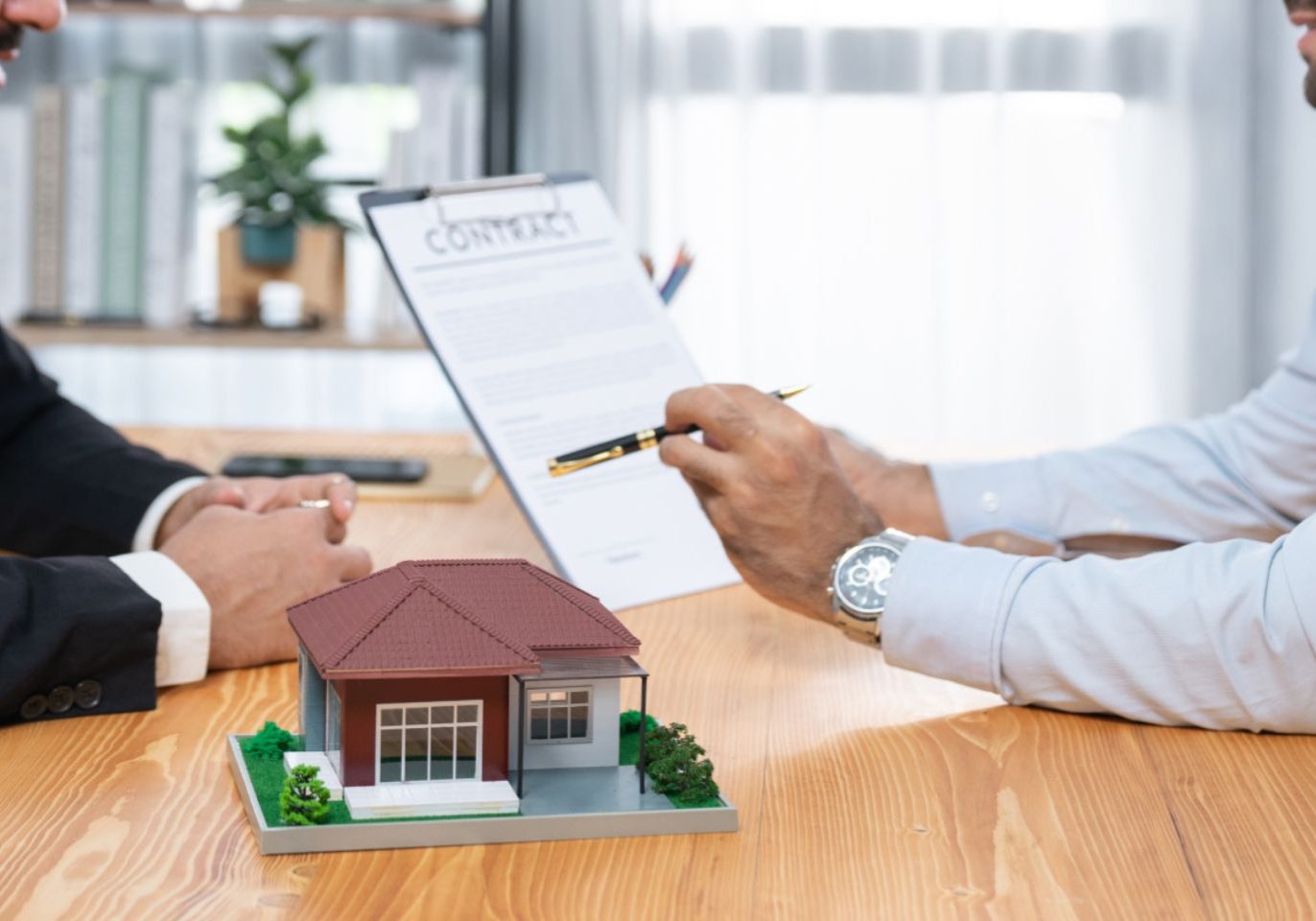 Buyer and seller reviewing earnest money terms in a Nevada real estate contract