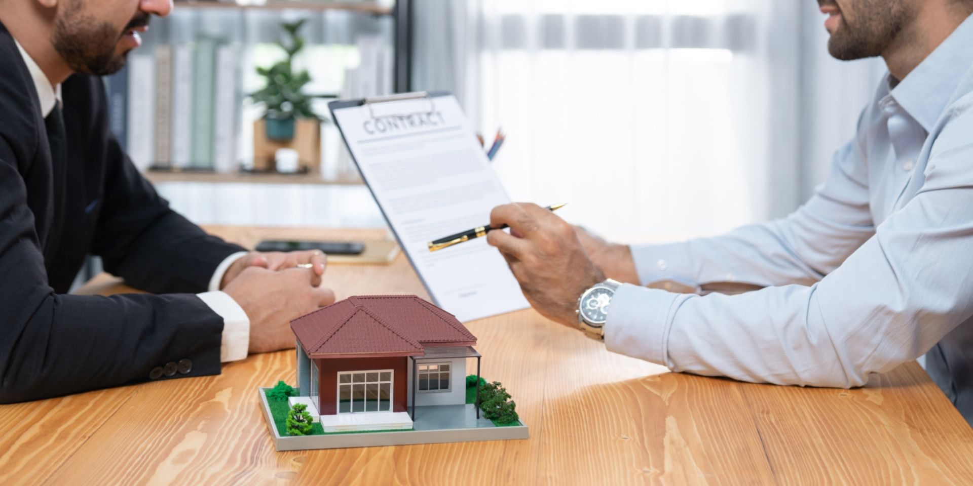 Buyer and seller reviewing earnest money terms in a Nevada real estate contract